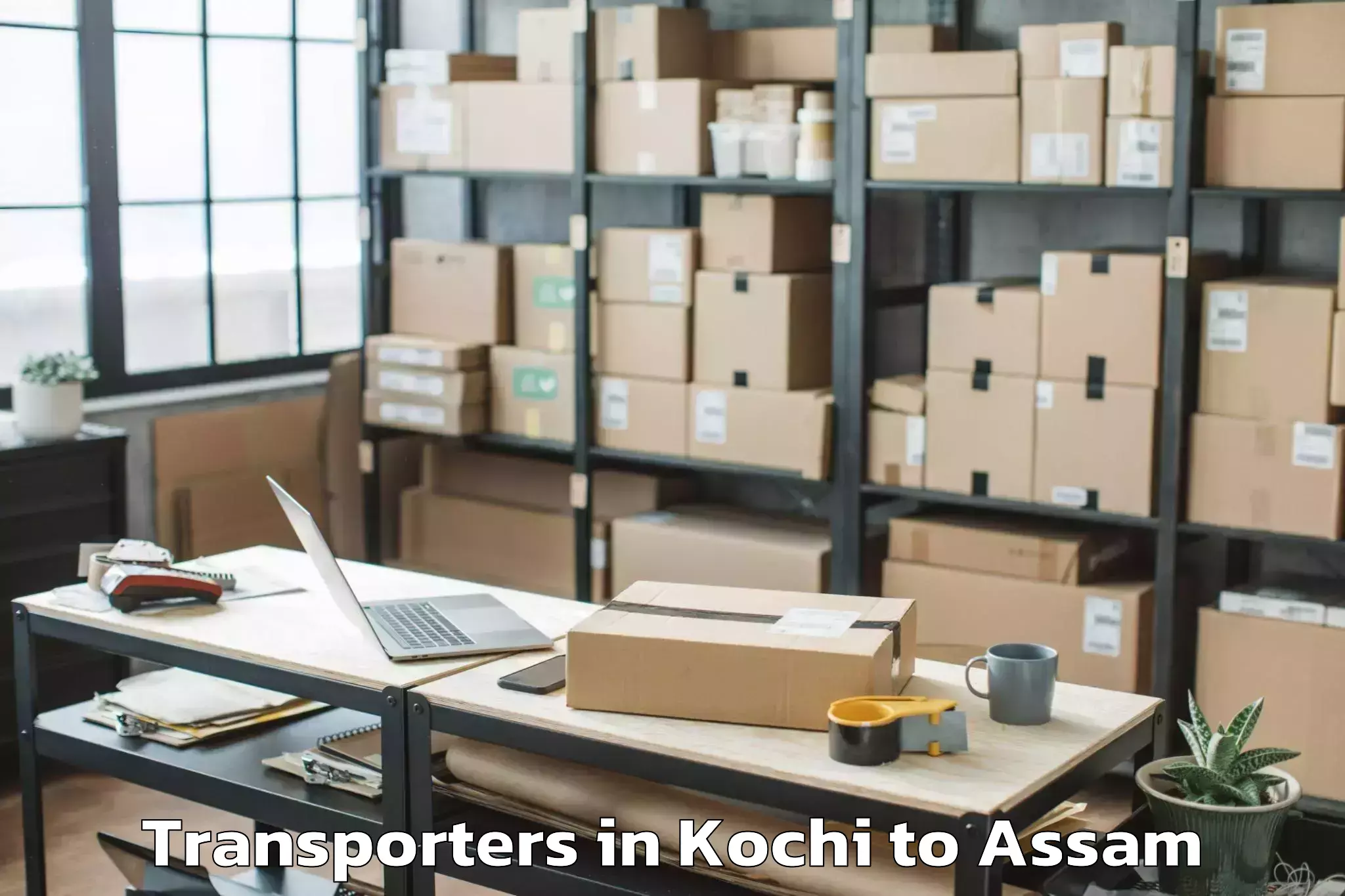 Book Kochi to Dhakuakhana Pt Transporters Online